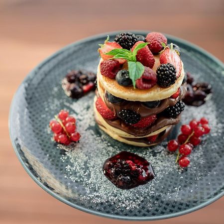 Address Istanbul Hotel Екстериор снимка A stack of pancakes with fruit